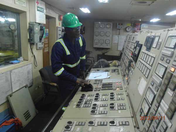 Engineer at an engine-room control console